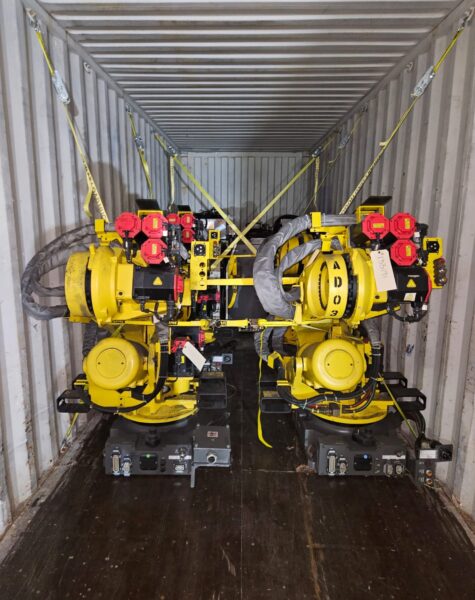 Automated industrial robotic equipment inside a manufacturing facility