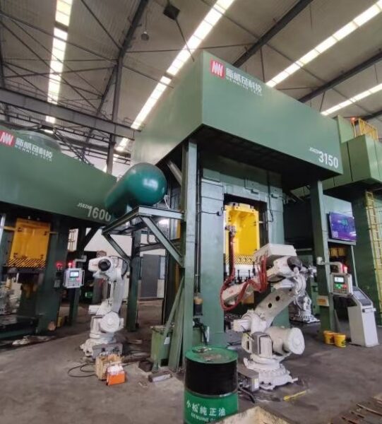 Heavy-duty forging press equipment in an industrial manufacturing plant